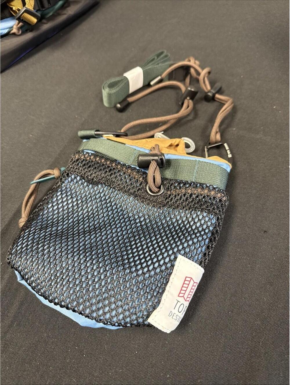 Topo Designs black mesh crossbody pouch with green trim